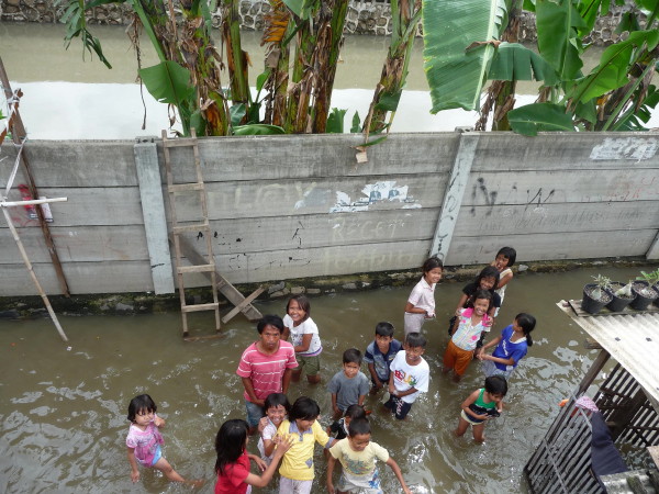 Children playing in flood waters