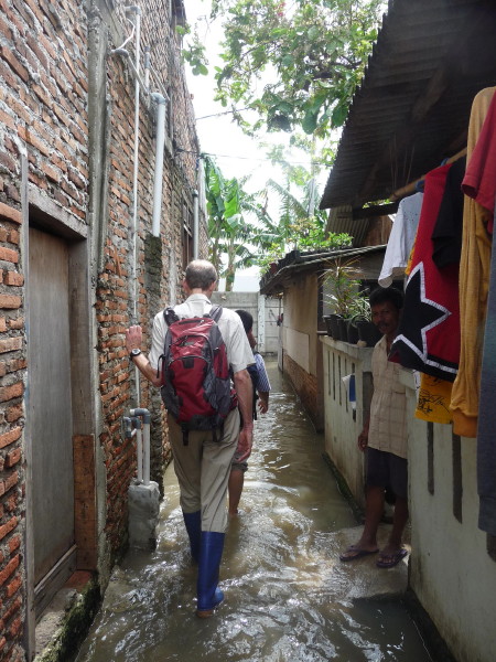 Strolling through a flooded Jakarta neighborhood